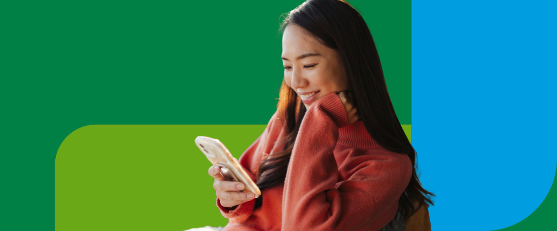 A doctor interacting with a patient. The doctor is turned away, holding a clipboard up to their patient who's face is bright with relief.