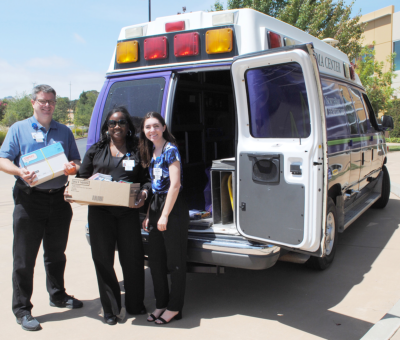 Yonja Arnold (center) donates back-to-school items to NorthBay Health Foundation financial analyst Tim Johnson and intern Sadie Johnstone as part of the Fill the Ambulance effort that began Monday at the Green Valley Administration Center.