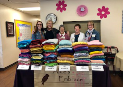 Diane Lewis's team of volunteers with Alice's Embrace brought plenty of the donated items, so all could ‘shop’ for just the right color, texture and size.