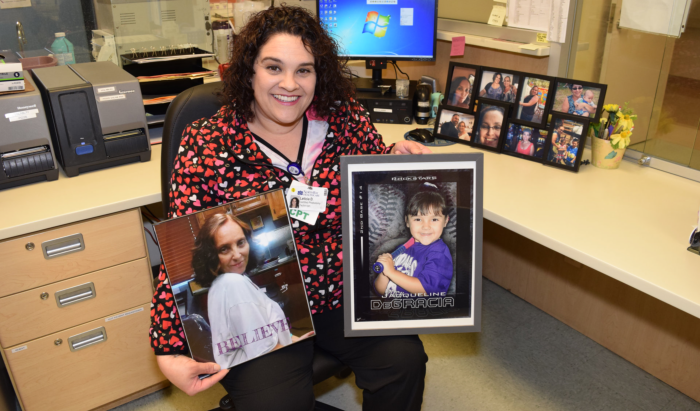 Lulu DeGracia holds photos of her mom and daughter. Both benefited from blood donations.