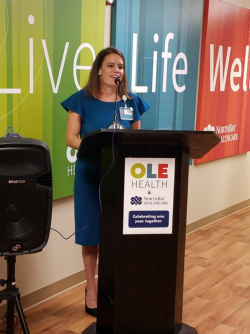 Alicia Hardy, CEO of OLE Health addresses the crowd during the celebration.